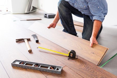contractor putting wood floor together